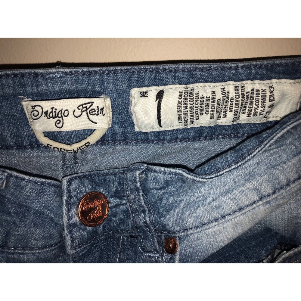 Distressed light wash jeans